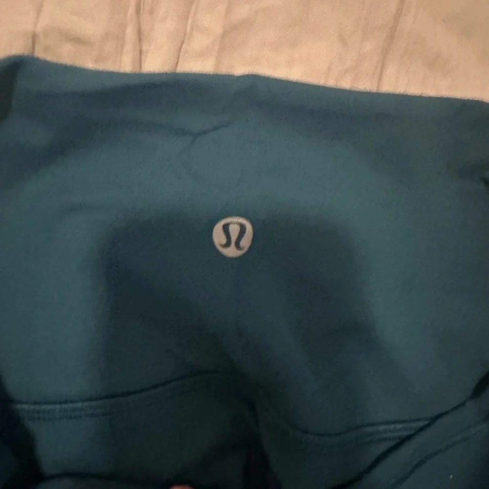 dark green lululemon wunder under 25” leggings - Picture 2 of 3